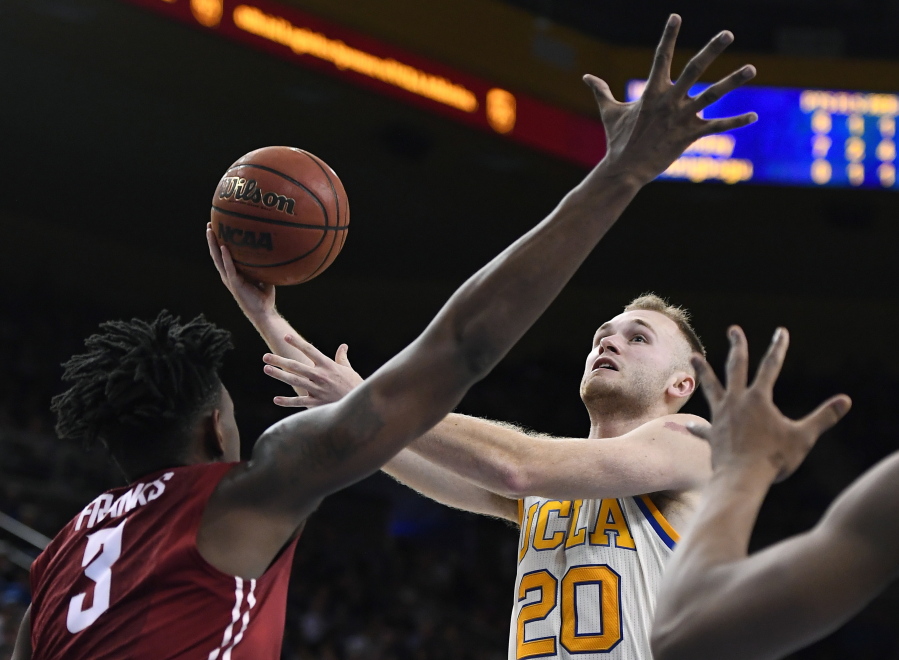 UCLA guard Bryce Alford, right, shoots as Washington State forward Robert Franks defends during the second half of an NCAA college basketball game, Saturday, March 4, 2017, in Los Angeles. (AP Photo/Mark J.