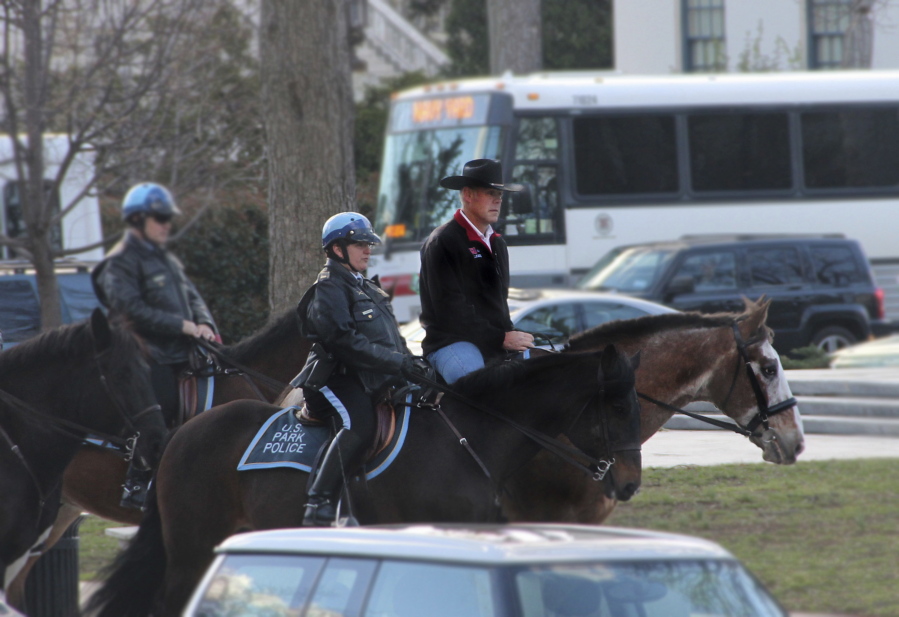 Interior Secretary Ryan Zinke arrives Thursday for his first day of work at the Interior Department in Washington aboard Tonto, an 17-year-old Irish sport horse. (U.S. Dept.