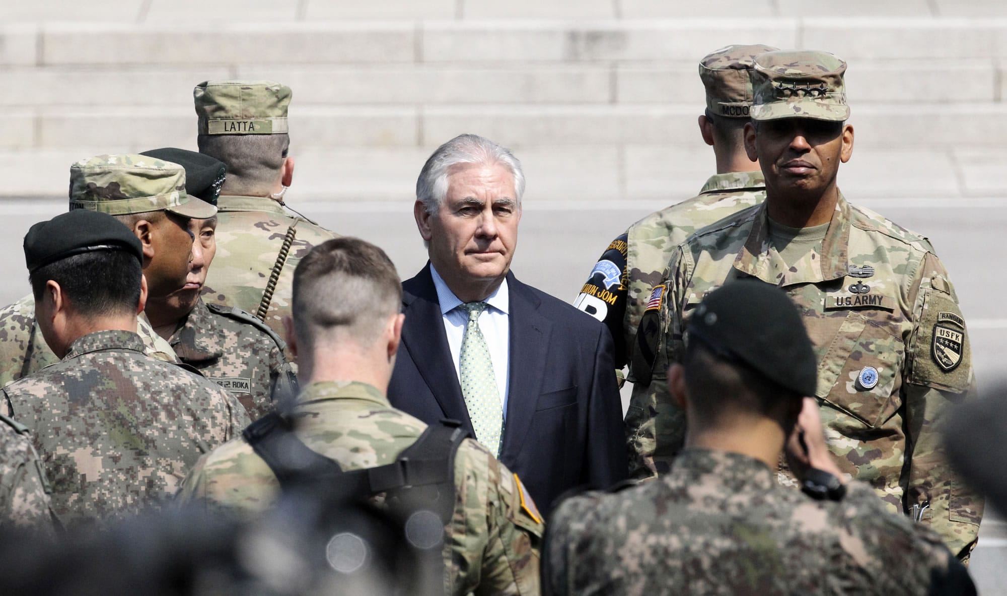 U.S. Secretary of State Rex Tillerson, center, visits with U.S. Gen. Vincent K. Brooks, commander of the United Nations Command, Combined Forces Command and United States Forces Korea, right, at the border village of Panmunjom, which has separated the two Koreas since the Korean War, South Korea, Friday, March 17, 2017.