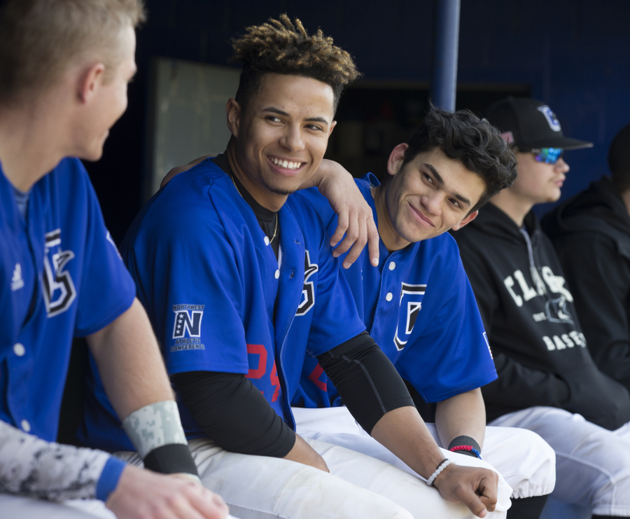 Clark College outfielder Charles Clark Jr. (second from left) and shortstop/second baseman Reinaldo Gonzalez have formed an otherwise unlikely friendship through the language of Spanish. (Randy L.