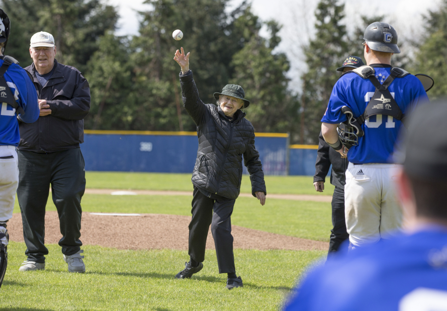 Bonnie Owen, a member of the U.S. Navy&#039;s WAVES during World War II, throws out a ceremonial opening pitch Sunday before Clark College&#039;s baseball game against the Linfield junior varsity. Sunday was Military Appreciation Day at Kindsfather Field. Malcolm Cameron, left, 77, is an Army veteran. (Randy L.