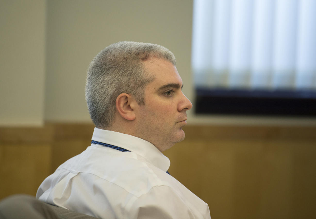 Stephen Reichow listens to opening statements in his murder trial April 6 in Clark County Superior Court. The jury on Monday convicted Reichow in the fatal beating of an acquaintance with a baseball bat in August 2015 in Battle Ground.