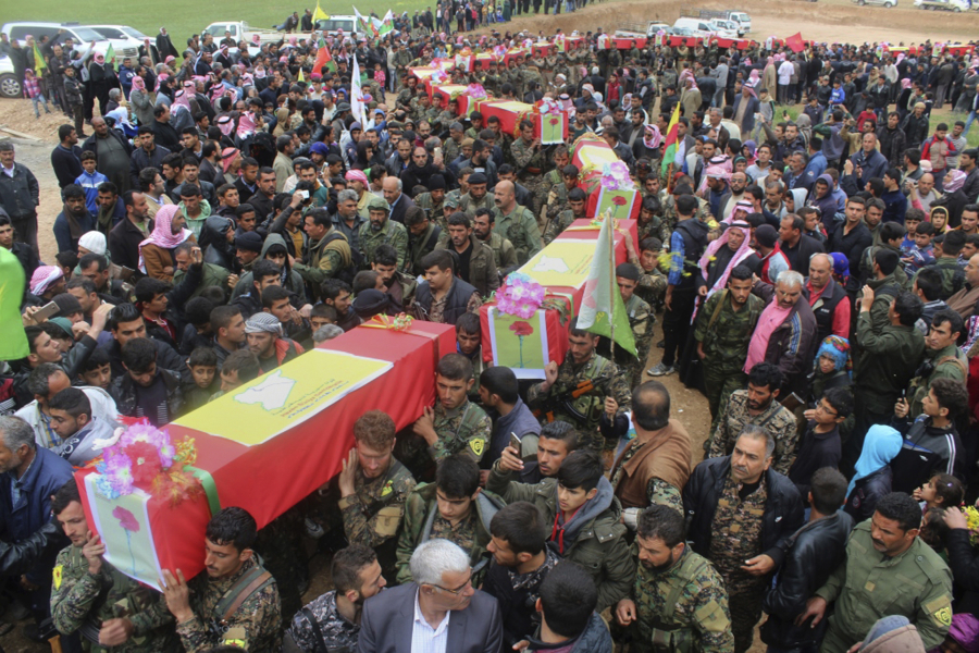 Fighters from the predominantly Kurdish Syrian Democratic Forces carrying the coffins of their comrades during their funeral procession Thursday in Tal al-Abyad, northeast Syria. U.S. officials said it was the SDF that provided the coordinates for the errant airstrike.