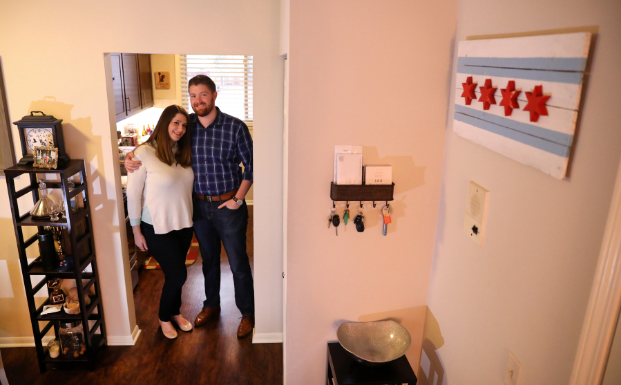 Jessica Doane and Russ Page, seen Wednesday, live in an apartment in Libertyville, Ill. The couple plan on purchasing their first home in Chicago soon.
