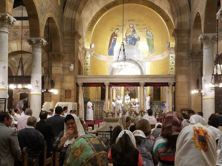 Coptic Christian families attend Easter services Saturday at the Chapel of St. Peter and Paul in Cairo, Egypt.