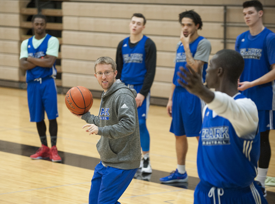 Clark College head coach Alex Kirk, with ball, works with the team Monday afternoon, Nov. 23, 2015 at O&#039;Connell Sports Center.