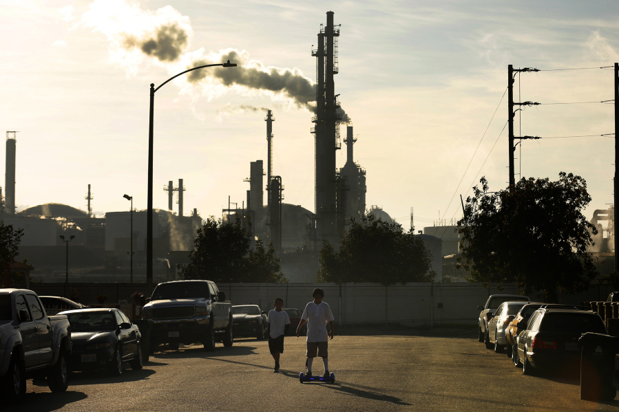 Jesse Ceja, 12, rides a Segway hoverboard in his neighborhood, which sits adjacent to the Phillips 66 refinery in the Wilmington, Calif. neighborhood where some long-time residents believe their health issues might stem from their proximity to the refinery.