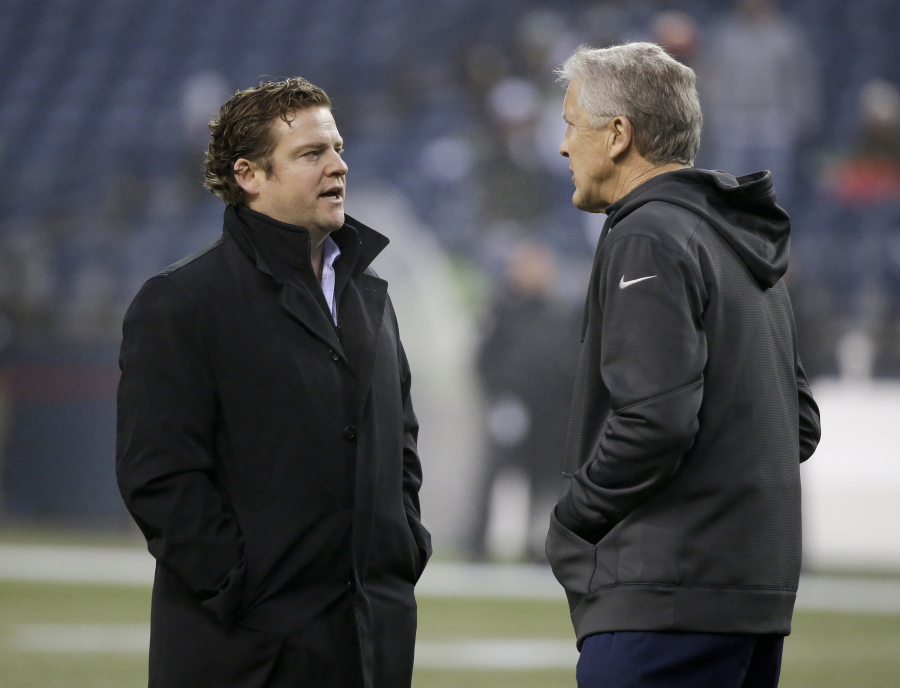 General manager John Schneider, left, and head coach Pete Carroll built the Seahawks into a title contender through the draft. However, selections in recent years have not panned out, making the five picks Seattle has in the first three rounds this year very big.