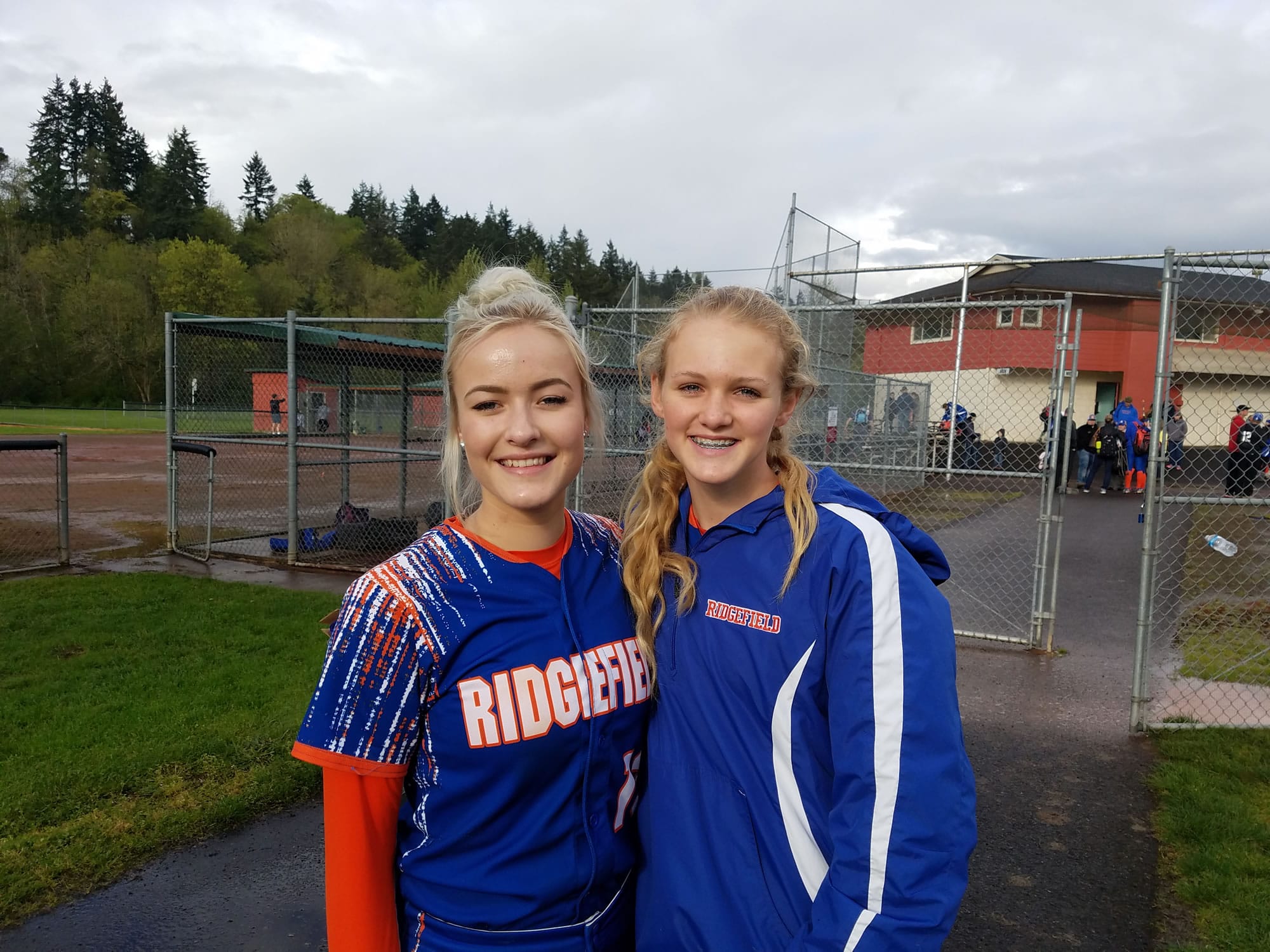Emma Jenkins (left) and Kaia Oliver of Ridgefield softball.
