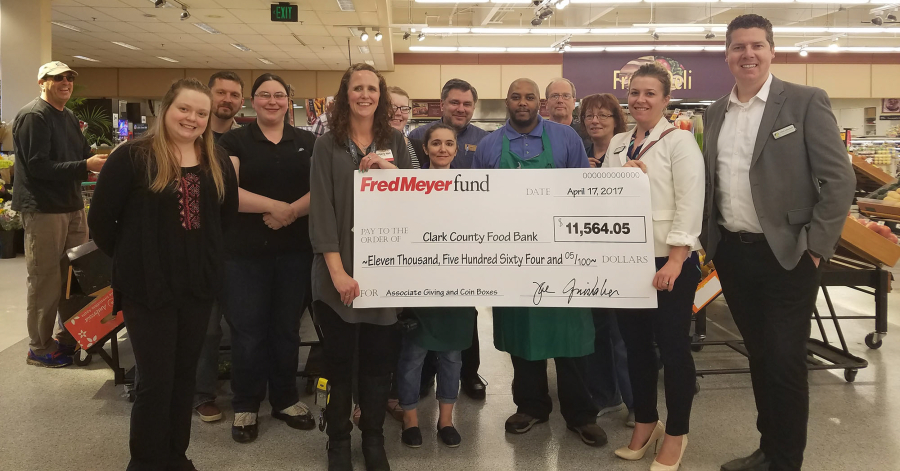 Minnehaha: Employees from the Hazel Dell Fred Meyer present a check to Clark County Food Bank representatives.