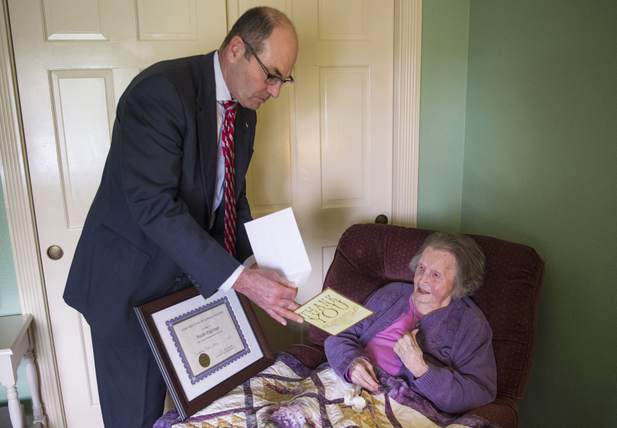 Clark County Auditor Greg Kimsey presents Mable Engeman, the county&#039;s oldest eligible voter, with a certificate of appreciation for all the votes she&#039;s cast since she became eligible to vote in 1934.