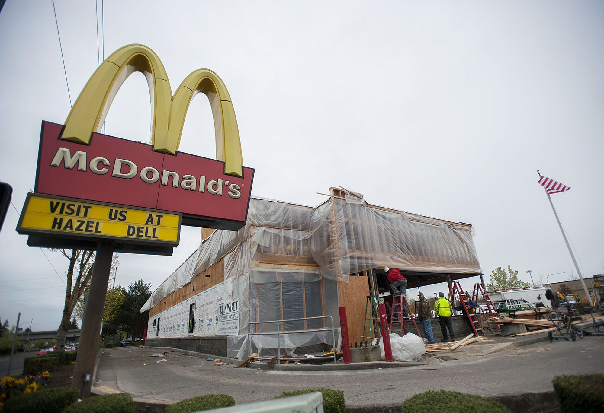 Construction workers help remodel the Northeast 99th Street McDonald's Monday afternoon.
