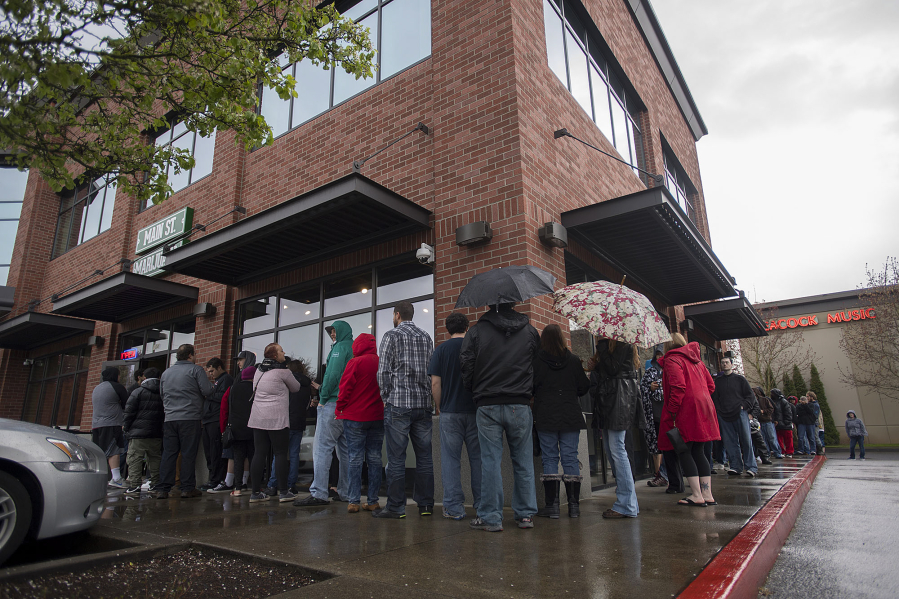 A line of customers curves around Main Street Marijuana&#039;s southeast Vancouver location on Thursday for its 420 sale. Owner Ramsey Hamide said they expected to triple or quadruple revenues on the marijuana holiday.