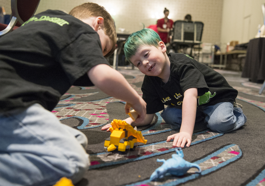 Declan Reagan, 5, right, plays with his twin brother, Adrian, during a bone marrow and blood donation event March 28 at The Nines hotel in Portland. Declan needs a lifesaving bone marrow transplant.