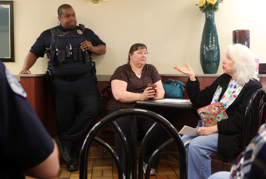 Citizens ask Vancouver police Officer McAvoy Shipp questions Tuesday at &quot;Coffee with a Cop&quot; at the McDonald&#039;s on Andresen Road in Vancouver.