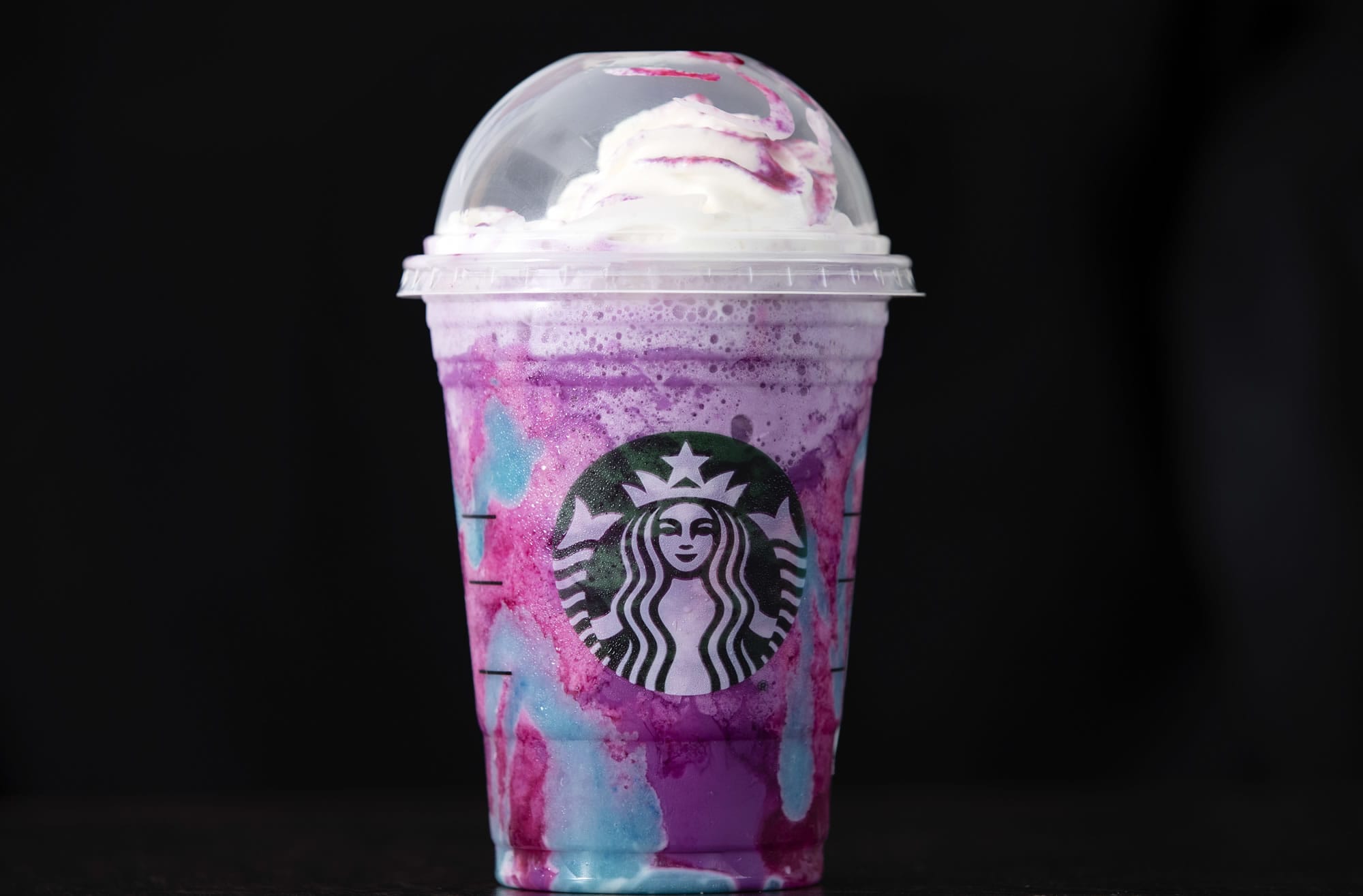 A Starbucks Unicorn Frappuccino drink sits on display, Thursday, April 20, 2017, in Philadelphia. Starbucks' entry into the unicorn food craze was released Wednesday and its popularity was too much for Colorado barista Braden Burson. He posted a video on Twitter complaining that the drink was difficult to make and he's "never been so stressed out" in his life.