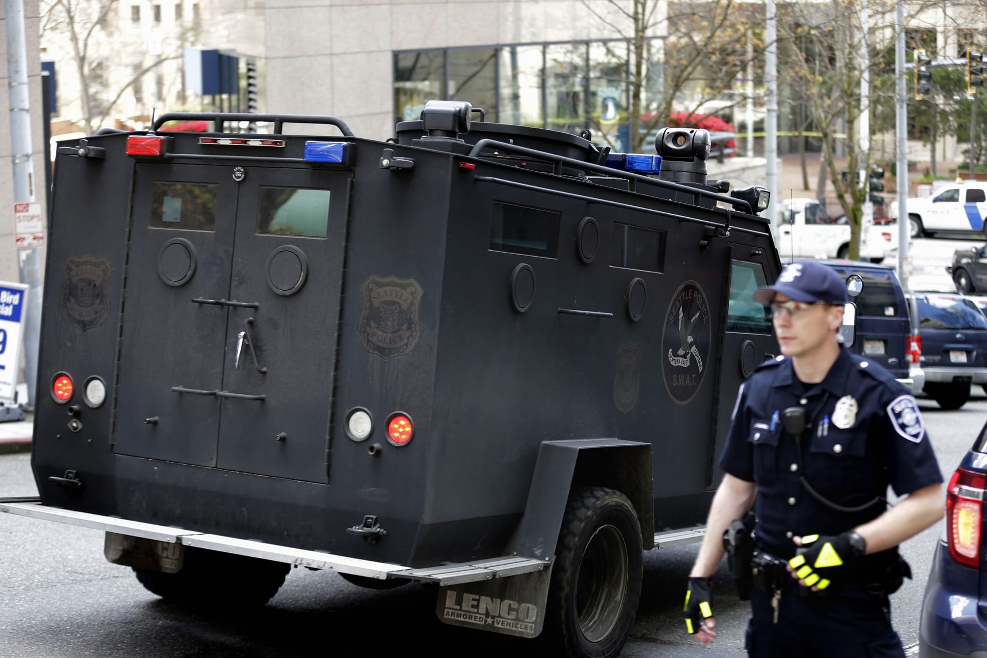 A Seattle Police SWAT vehicle drives near the scene of a shooting involving several police officers in downtown Seattle, Thursday, April 20, 2017. (AP Photo/Ted S.