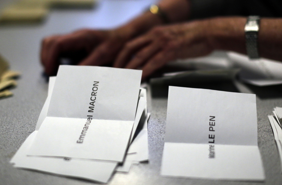 Ballots are counted by volunteers for the first-round presidential election at a polling station in Paris, Sunday. French voters have casted ballots for the presidential election in a tense first-round poll that&#039;s seen as a test for the spread of populism around the world.