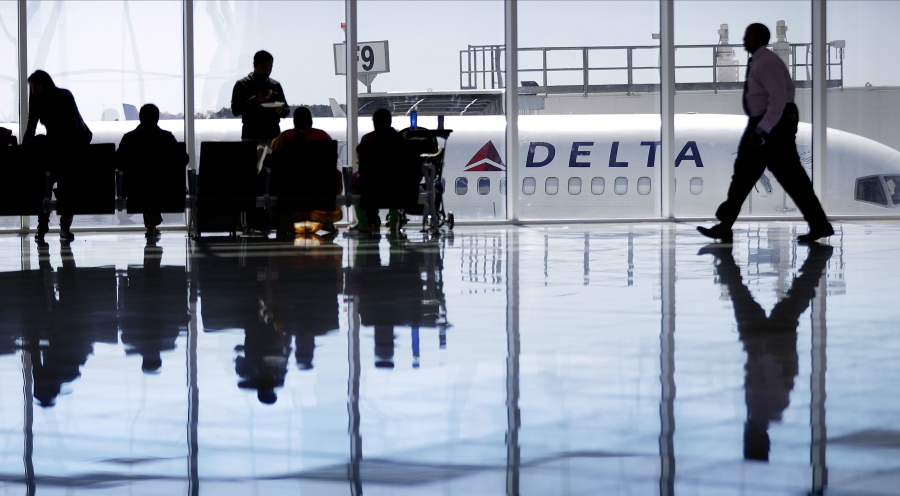 A Delta Airlines jet sits at a gate at Hartsfield-Jackson Atlanta International Airport in Atlanta in  2016.