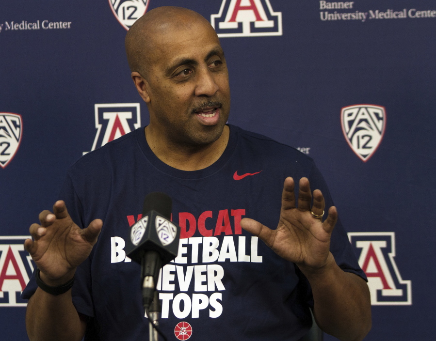 Lorenzo Romar answers questions during an NCAA college basketball press conference, Thursday, April 20, 2017, at the University of Arizona in Tucson, Ariz. Romar, the former head men&#039;s basketball coach at the University of Washington, joined the staff of Arizona coach Sean Miller, who used to be one of his chief rivals.