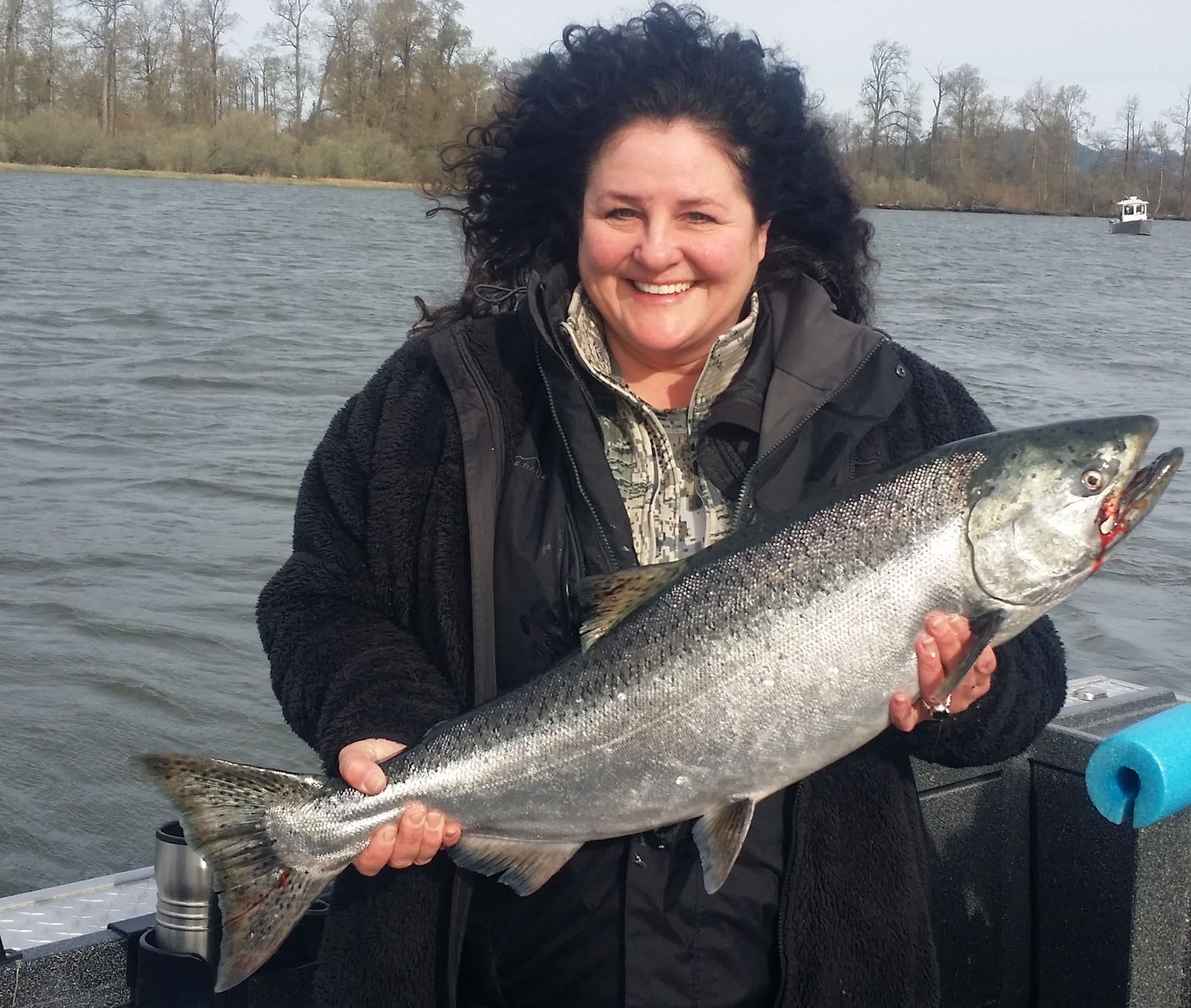 Baabs Teed of Vancouver holds a spring chinook she caught while anchor fishing in the lower Columbia River.