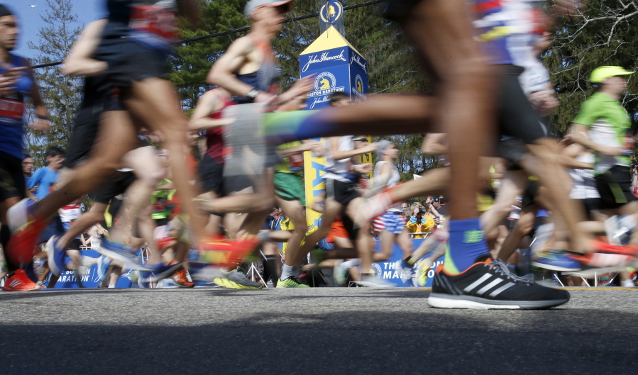 Runners in the first wave cross the line at the start of the 2017 Boston Marathon in Hopkinton, Mass., Monday, April 17, 2017.