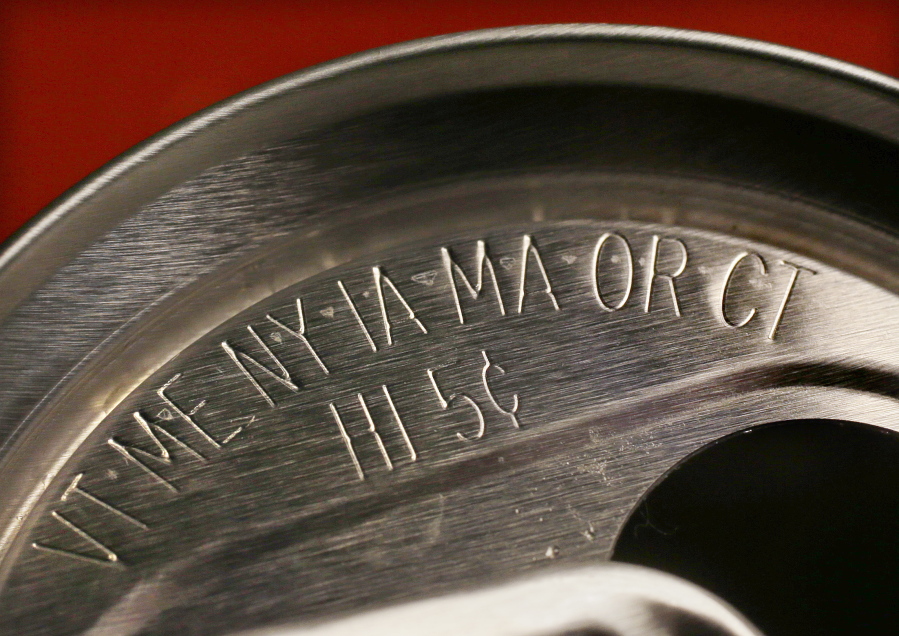 Markings on a soda can that it is subject to a 5-cent deposit. Oregon increased its deposit to 10 cents on April 1.