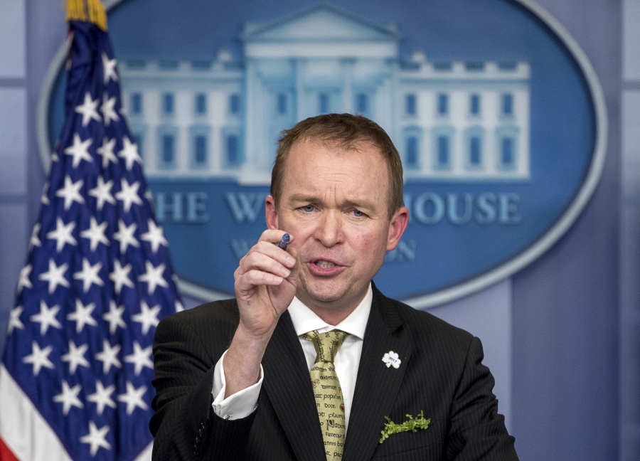 White House budget director Mick Mulvaney speaks March 16 at the White House, in Washington. Mulvaney says that Democratic negotiators on a massive spending bill need to agree to funding top priorities of President Donald Trump, such as a down payment on a border wall and hiring of additional immigration agents.