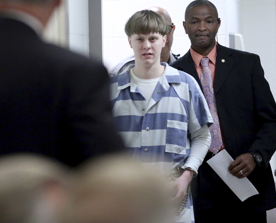Dylann Roof enters the courtroom Monday at the Charleston County Judicial Center in Charleston, S.C., to enter his guilty plea on murder charges.