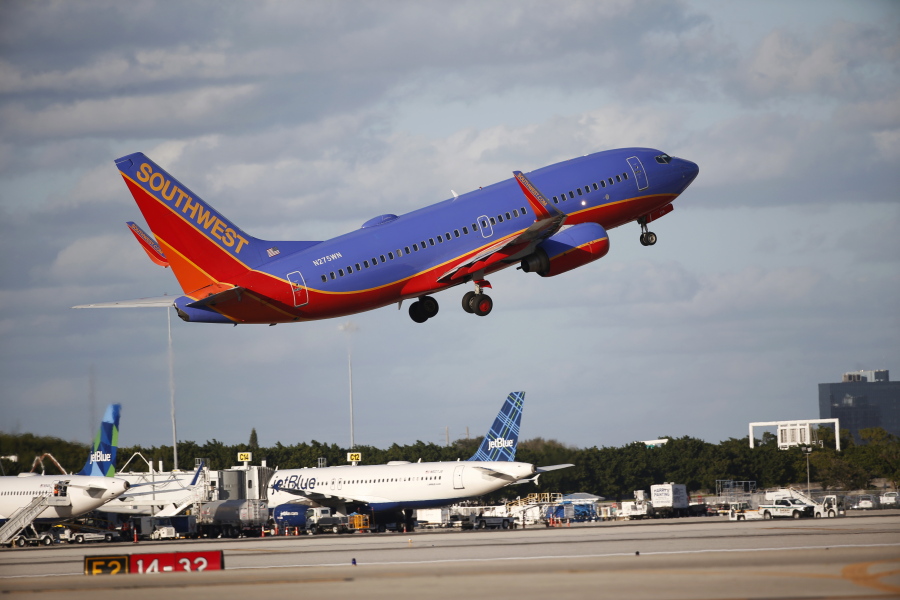 A Southwest Airlines plane takes off from Palm Beach International Airport in West Palm Beach, Fla. Southwest Airlines Co.