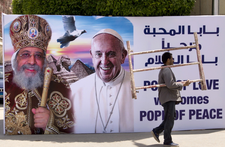 A billboard with a picture of Egyptian Coptic Pope Tawadros II, left, welcomes Pope Francis on Thursday at St. Mark&#039;s Cathedral in Cairo, Egypt. Francis arrives in Egypt today.