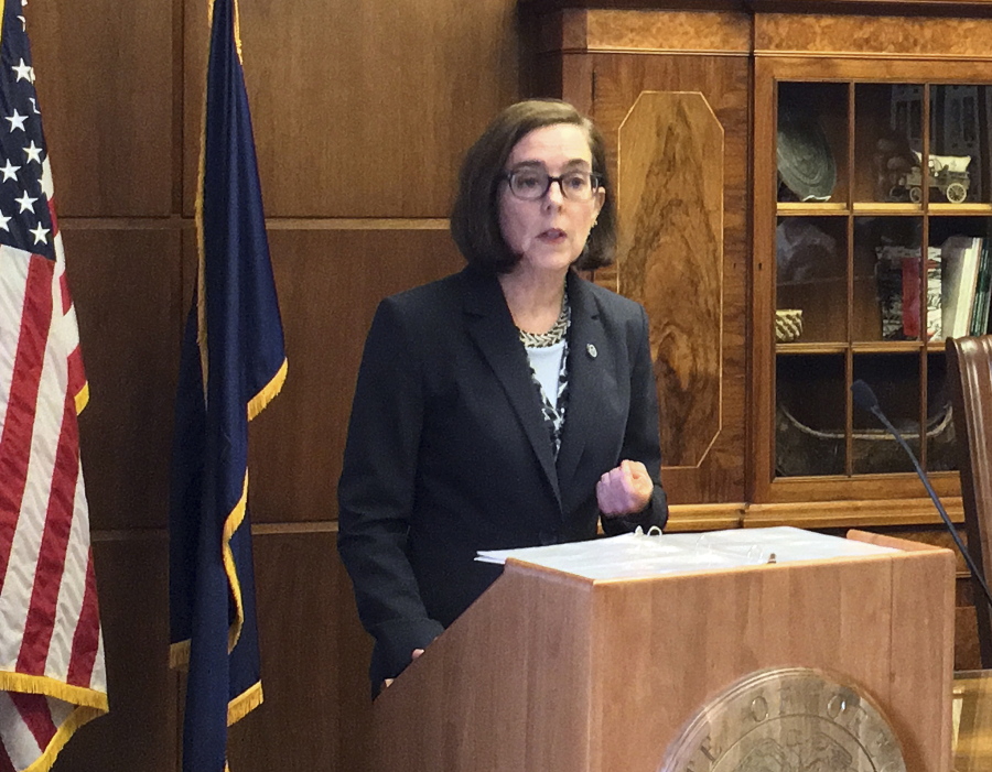 Oregon Gov. Kate Brown speaks in the Capitol ceremonial office in Salem, Ore., Thursday, April 27, 2017. Brown announced two executive orders and a task force she says will help cut back on salary, retirement and health care costs for public employees and recover uncollected debt and taxes as the state faces a $1.6 billion budget shortfall.