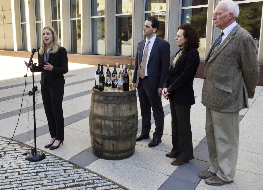 Attorneys Meagan Forbes, from left, and Anthony Sanders, and Minnesota winery owners Nan Bailly and Timothy Tulloch, hold a news conference Tuesday outside the federal courthouse in Minneapolis to announce a lawsuit seeking to overturn a law that requires them to make their products with a majority of grapes grown in Minnesota, a state that&#039;s better known for its winters than vineyards.