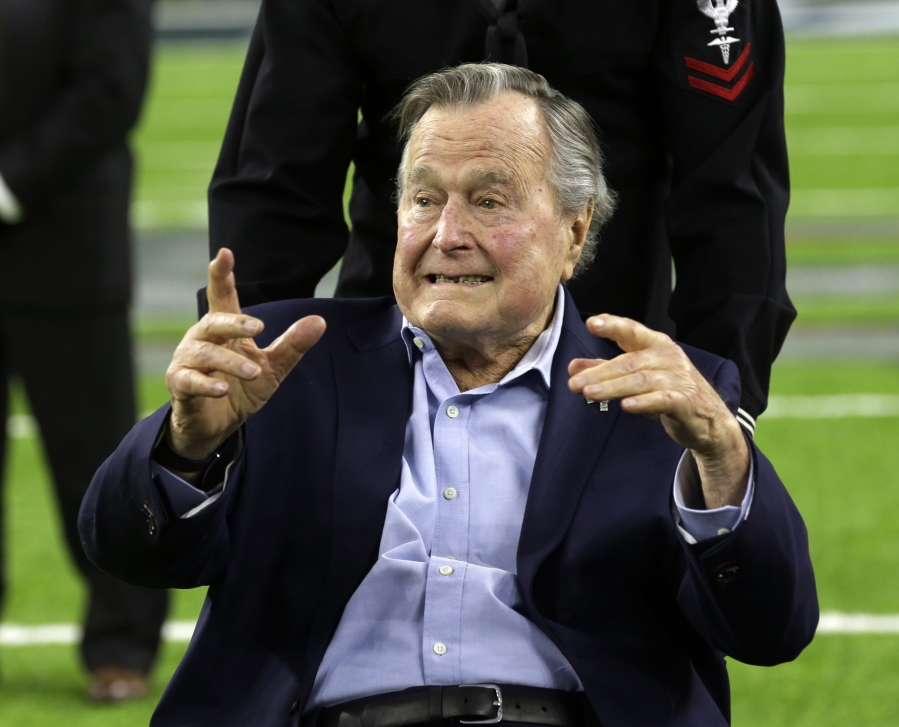FILE - In this Feb. 5, 2017, file photo, former President George H.W. Bush arrives on the field for a coin toss before the NFL Super Bowl 51 football game between the Atlanta Falcons and the New England Patriots in Houston. Bush has been hospitalized in Houston since last Friday, Aprul 14, 2017,  with a recurrence of a case of pneumonia he had earlier in the year. Bush spokesman Jim McGrath said in a statement Tuesday, April 18, 2017, doctors determined he had a mild case of pneumonia which has been treated and resolved.