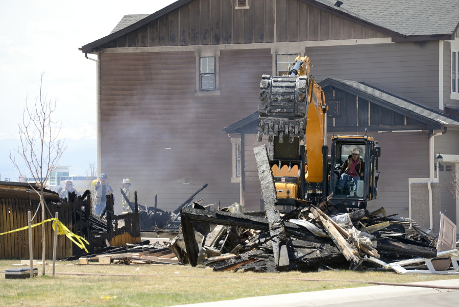 In this April 18, 2017, photo, investigators stand by as debris is removed from a house that was destroyed in a deadly explosion in Firestone, Colo., on April 17. Anadarko Petroleum said Wednesday, April 26, that it operated a well about 200 feet (60 meters) from the house in the town of Firestone. The company didn&#039;t say whether the well was believed to be a factor in the explosion or whether it produced oil, gas or both.