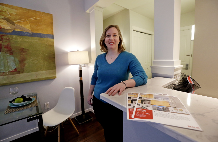 Kathleen Mulcahy in her recently sold one-bedroom condo, on which she received nearly two dozen offers and sold for more than $100,000 over her asking price, in Seattle&#039;s Belltown neighborhood.