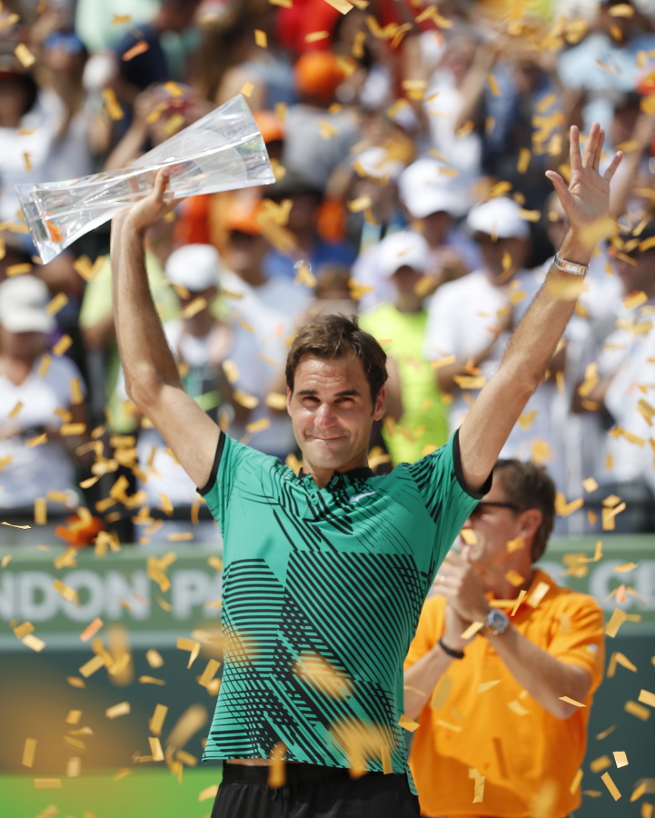 Roger Federer, of Switzerland, holds up his trophy after defeating Rafael Nadal, of Spain, during the men&#039;s singles final tennis match at the Miami Open, Sunday, April 2, 2017 in Key Biscayne, Fla.