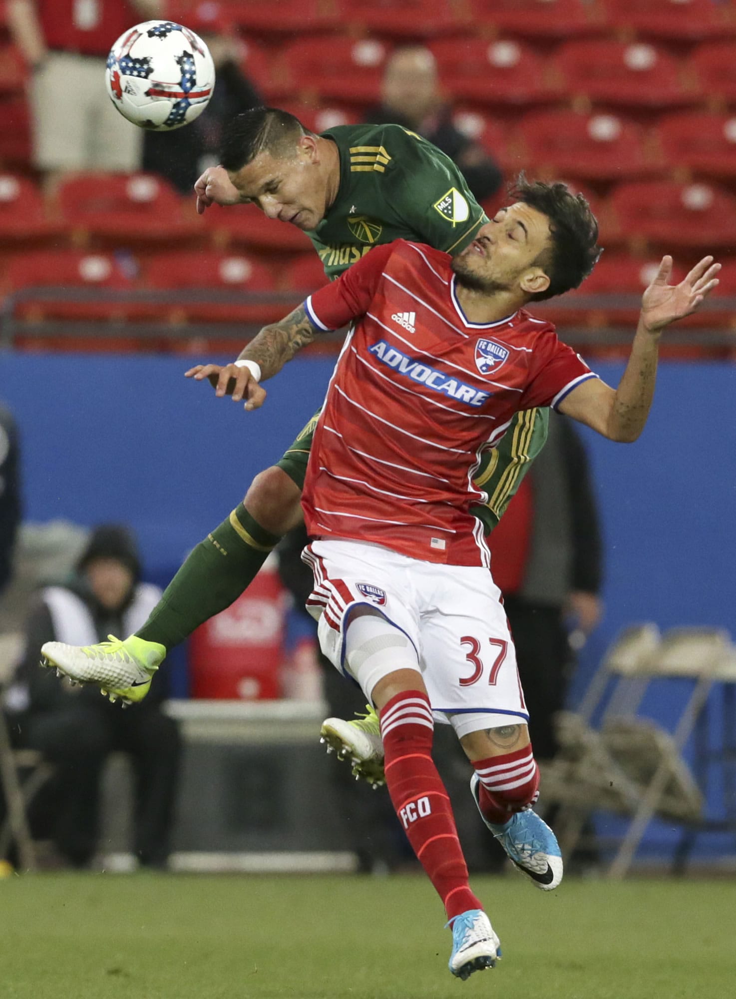 Portland Timbers midfielder David Guzman, left, and FC Dallas forward Maximiliano Urruti (37) vie for control of the ball during the first half of an MLS soccer match in Frisco, Texas, Saturday, April 29, 2017.