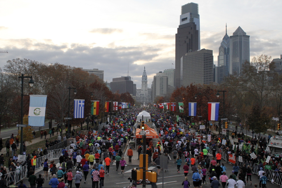 Runners make their way down Benjamin Franklin Parkway in Philadelphia during the Philadelphia Marathon in 2012. A study shows it takes longer for nearby residents to get to a hospital for emergency heart care on the day of a marathon.