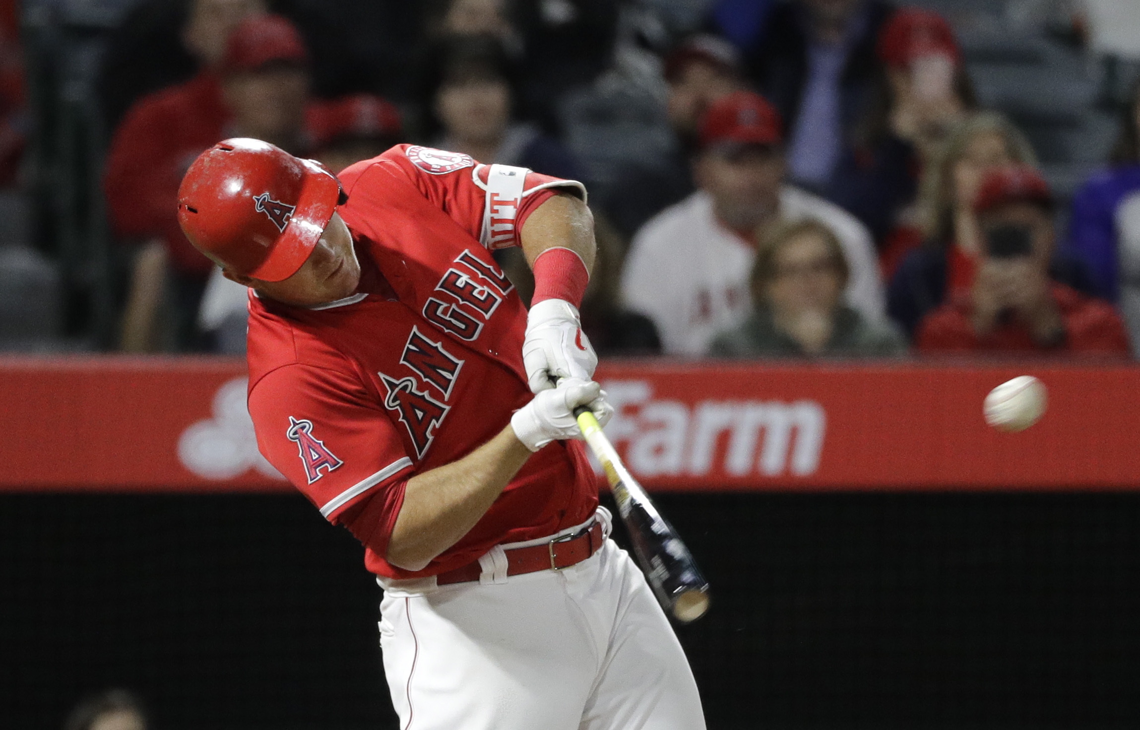 Los Angeles Angels' Mike Trout hits a two-run home run during the seventh inning of the team's baseball game against the Seattle Mariners on Saturday, April 8, 2017, in Anaheim, Calif. (AP Photo/Jae C.