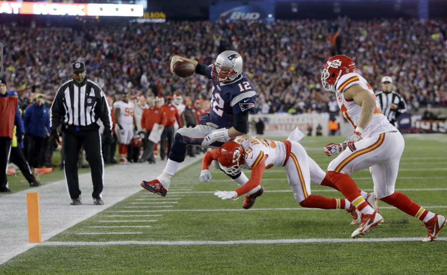 Chiefs free safety Husain Abdullah (39) pushes Patriots quarterback Tom Brady (12) out of bounds short of the goal line during a 2016 divisional game in Foxborough, Mass. The two teams will kick off the 2017 regular season against each other on Sept. 7.