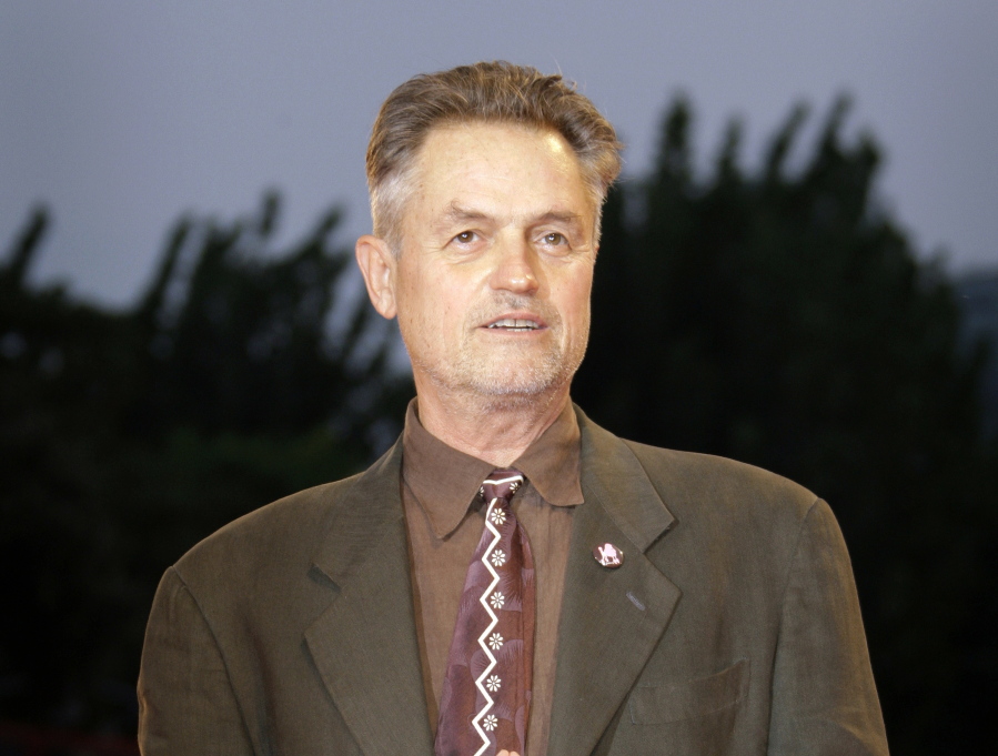 Filmmaker Jonathan Demme poses Sept. 3, 2008 during the photo call of the movie &quot;Burn After Reading&quot; at the 65th edition of the Venice Film Festival in Venice.  Demme died, Wednesday from complications from esophageal cancer in New York. He was 73.