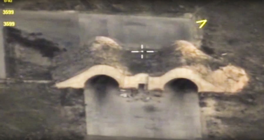 In this photo made from the footage taken from Russian Defense Ministry official website Friday, April 7, 2017, an aerial view shows shelters for aircraft at a Syrian airbase after it was hit by US strike in Syria. Russia reacted to U.S. military strikes on its ally Syria Friday by cutting a hotline intended to prevent midair incidents, a response that demonstrates Moscow&#039;s readiness to defy Washington.