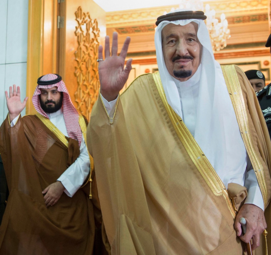 Saudi Defense Minister and Deputy Crown Prince Mohammed bin Salman, left, and King Salman wave April 5 as they leave the hall after talks with the British prime minister, in Riyadh, Saudi Arabia.