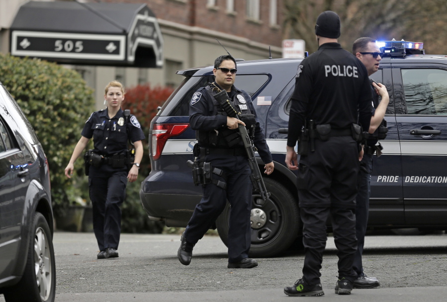 Seattle police officers respond to a call of an armed man barricaded in his apartment in Seattle in 2016. Police, including several members of SPD&#039;s crisis response unit, were able to resolve the situation peacefully.