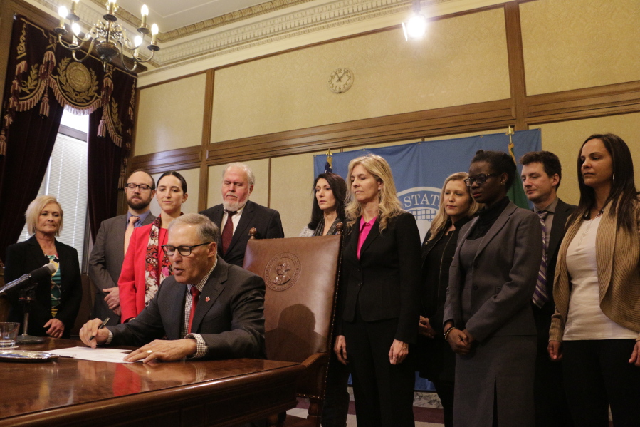 Gov. Jay Inslee signs a measure Tuesday to make it easier for victims of sex trafficking to vacate their prostitution convictions. The new statute applies to minors and adults who received convictions in the state.