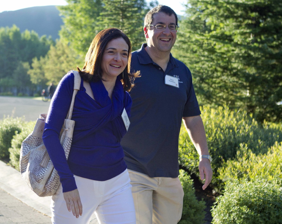 Facebook COO Sheryl Sandberg, left, and her husband, David Goldberg, CEO of SurveyMonkey, arrive at the Sun Valley Inn for the Allen and Co. Sun Valley Conference, in Sun Valley, Idaho. Sandberg&#039;s new book &quot;Option B: Facing Adversity, Building Resilience and Finding Joy,&quot; written with psychologist Adam Grant, chronicles her grief and road to recovery and resilience, following the death of her husband.