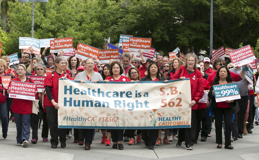 Supporters of single-payer health care march to the Capitol Wednesday in Sacramento, Calif.