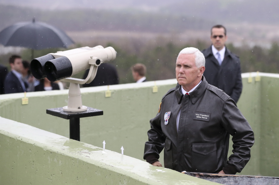U.S. Vice President Mike Pence looks at the North side from Observation Post Ouellette in the Demilitarized Zone, near the border village of Panmunjom, which has separated the two Koreas since the Korean War, South Korea, on Monday. Viewing his adversaries in the distance, Pence traveled to the tense zone dividing North and South Korea and warned Pyongyang that after years of testing the U.S.