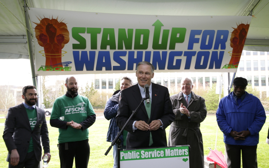 Washington Gov. Jay Inslee speaks Wednesday during a rally held by the American Federation of State, County and Municipal Employees at the Capitol in Olympia. (Photos by Ted S.